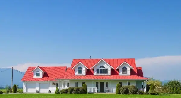 Modern single-storey house with red roof tiles showcasing durable residential roofing design